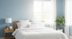 Soft blue walls with white bedding creating a peaceful bedroom