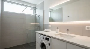 Washing machine under counter creating a seamless bathroom look