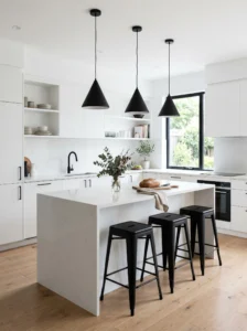 Matte black pendant lights over white kitchen island with modern contrast design