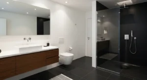 Black floor grounding a white bathroom