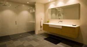 Dark floor balancing light bathroom walls