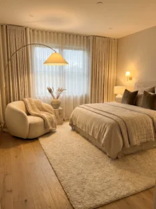 Monochrome cream bedroom with layered textures for a serene look