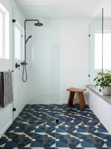 Statement tile shower floor with bold geometric pattern design