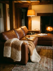 Brown couch with a cozy throw blanket for a warm inviting look