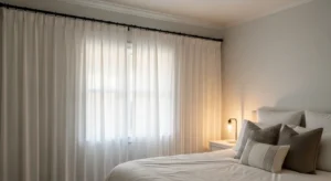 White curtains with black rods creating subtle contrast