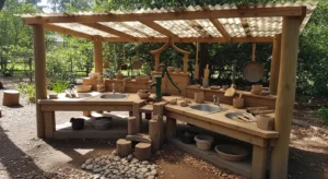 Mud kitchen with shade for outdoor comfort