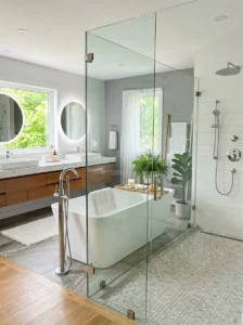 Bathtub with glass shower panel creating a clean and open bathroom look