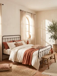 Light terracotta and off-white bedroom with airy warm aesthetic
