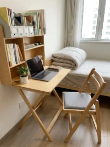 Foldable furniture in small bedroom for flexible space use