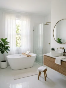 White bathroom with soft curtains creating a light and airy feel