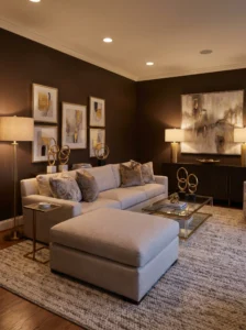 Dark chocolate brown living room walls paired with light furniture and warm lighting for a cozy dramatic look