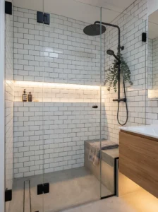 Modern shower with matte black fixtures and white tiles for bold contrast