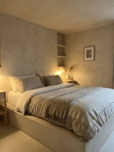 Neutral bedroom with textured walls adding depth and visual interest