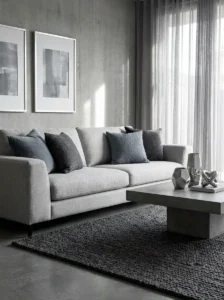 Layered grey living room design with grey couch and monochrome styling