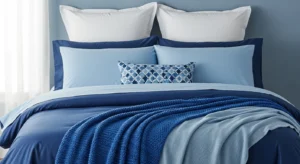 Layered blue bedding adding depth and style to a bedroom