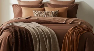 Layered brown bedding creating a rich and cozy bedroom look