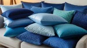 Layered blue throw pillows on sofa