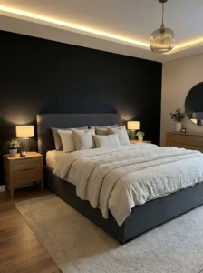 Black accent wall behind bed creating a bold bedroom focal point