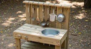 Mud kitchen with hanging tools for organization