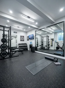 “Basement home gym with weights and mirror setup”