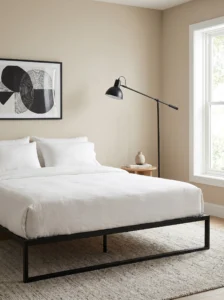 Neutral bedroom with black accents adding contrast and structure
