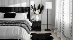 Layered textures adding depth to a black and white bedroom