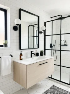 White bathroom with black accents creating a bold modern contrast