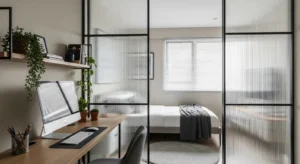 Room divider creating separation in a guest room office combo