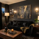 Dark living room with charcoal walls, black sofa, and gold accents creating a dramatic and cozy interior design