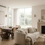 Open plan living room dining room combo with beige aesthetic, modern furniture, and cozy natural lighting