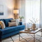 Blue sofa living room with modern decor, cozy textures, and balanced neutral styling