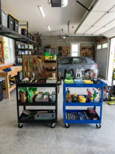 Rolling utility carts organizing garage supplies and tools.