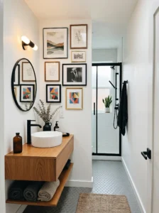 Small bathroom featuring a curated gallery wall with mixed framed artwork.