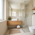 “Modern small bathroom designed to feel larger with floating vanity and large mirror”