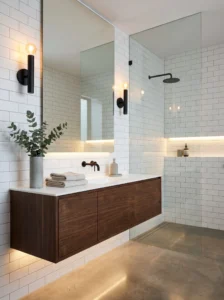 Modern black metal bathroom sconces creating contrast in a minimalist bathroom.