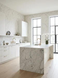Elegant kitchen with marble-look wallpaper and luxurious gold accents.
