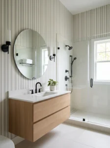 Small bathroom featuring gray and white vertical stripe wallpaper.