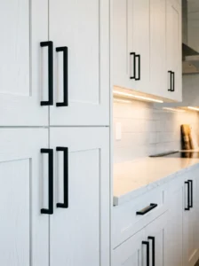 Modern cabinet hardware upgrade with matte black handles.