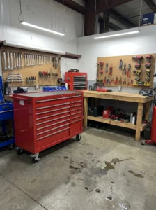 Mobile rolling storage cart used for organizing garage tools.