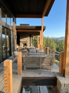 Modern porch with horizontal cable railings offering unobstructed outdoor views.