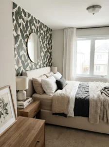Bedroom accent wall decorated with botanical peel-and-stick wallpaper.