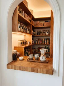 Small prep or landing shelf inside a converted pantry closet