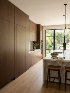 Small pantry seamlessly blended into surrounding kitchen cabinetry