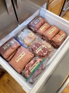 Labeled bulk meat packages organized for freezer storage