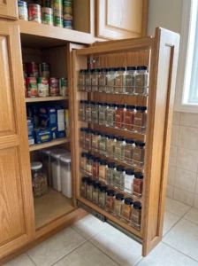 Slide-out spice shelving for a narrow pantry gap
