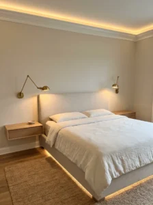 Master bedroom with wall-mounted sconces replacing traditional bedside table lamps