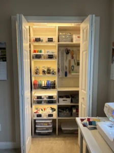 Closet converted into an organized sewing thread and notions storage station