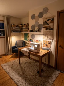 Soundproofed sewing room with acoustic panels and rug for quieter sewing