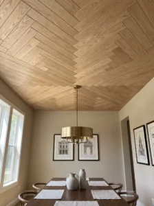 Herringbone wood ceiling pattern in an elegant dining room