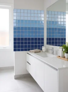 Blue square mosaic tiles arranged in horizontal ombré rows transitioning from light blue to deep navy.